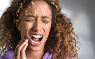 Как снять чувствительность зубов: причины явления и что делать